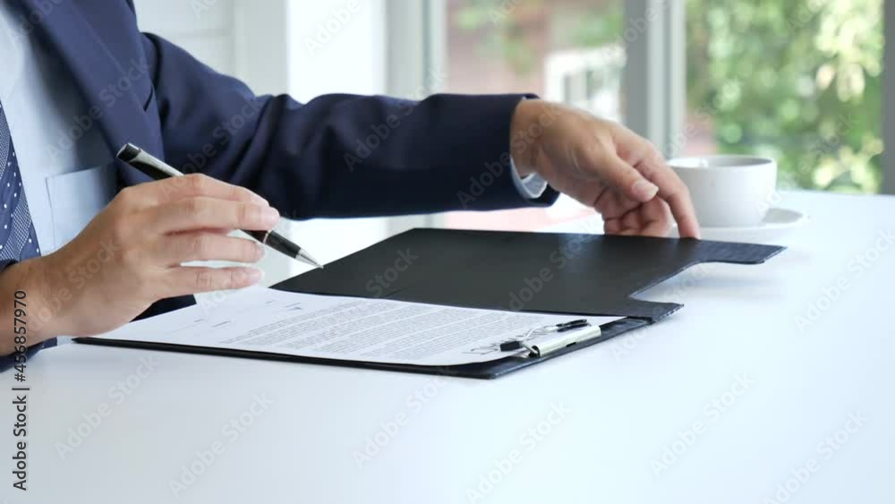 Businessman hand using pen signing on new contract to starting projects ...