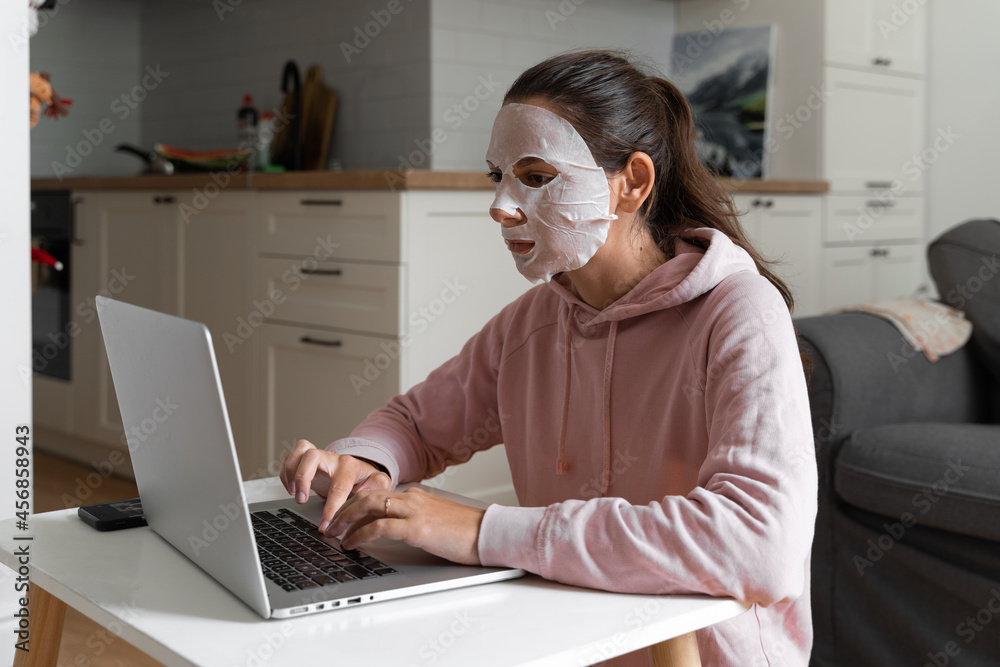 Young woman with beauty mask at home. Snackable wellness concept. Self care for home office . Quick face mask for home spa. Young woman with beauty mask at home. Snackable wellness concept. Self care for home office . Quick face mask for home spa.