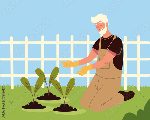 old man planting in the field