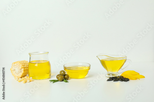 Set of different oils on white background