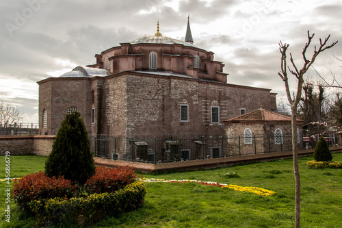 Little Hagia Sophia Mosque in istanbul with cloudy sky and green grass