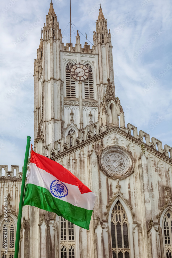 Fototapeta premium Indian national flag in front of St. Paul's Cathedral church Kolkata on Independence day