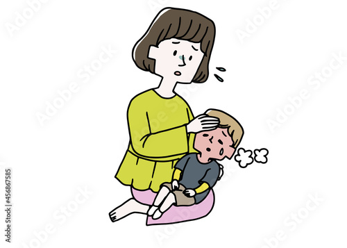 熱を出した子供のおでこに手を当てるママ