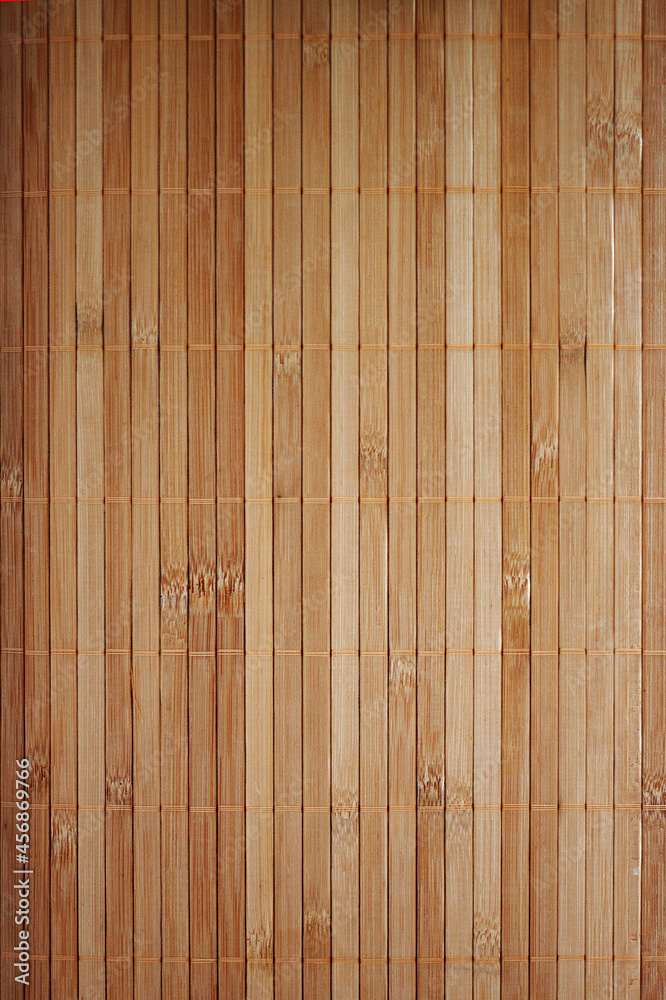 Fototapeta premium Wood texture background of a bamboo laundry basket. Top view of small wooden boards. Light brown surface with natural color.