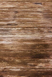 Top view of a wooden table with knots and cracks, light brown surface of knotted wood with natural color, wooden texture background