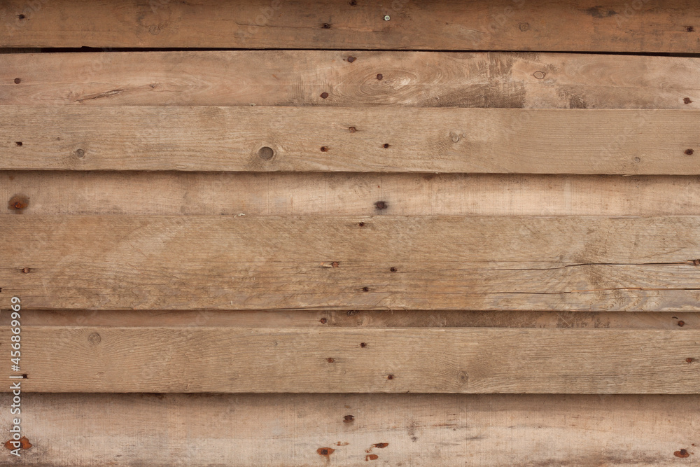 Obraz premium Rough wooden board texture background pattern brown with visible nails