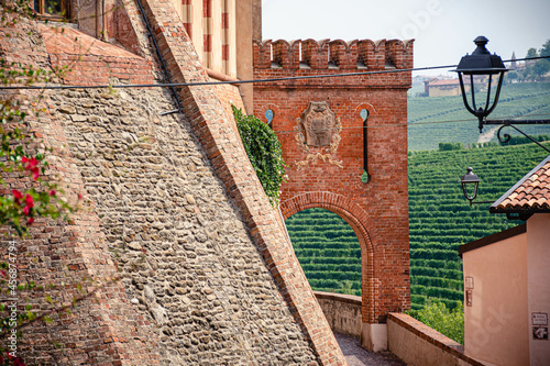 Medieval castle and street  of Barolo, Piemonte, Langhe wine district and Uneso heritage, Italy with view of vineyards photo