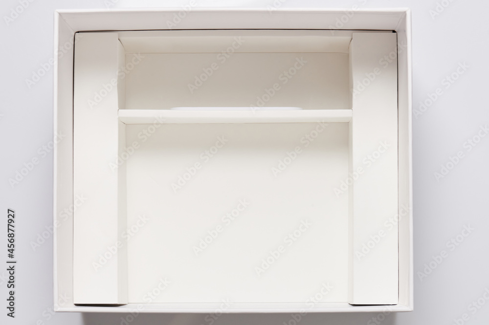 Open white box with compartment Open white box with compartment