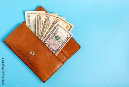 Open wallet with dollars. Copy space.