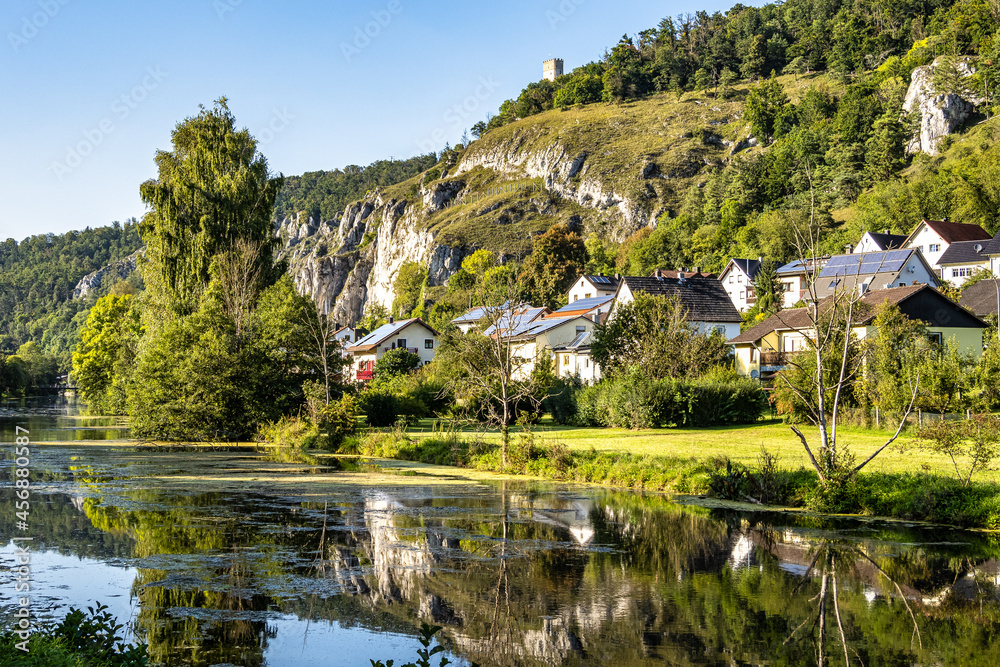 Sunset view of Essing with the ruins of Randeck castle over the river Altmuehl in Bavaria, Germany