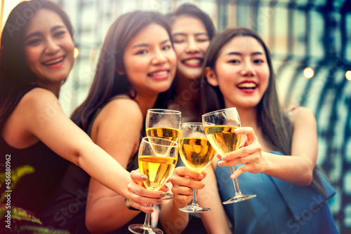 Party time start. Happy people toasting with champagne flutes. Multiethnic friends congratulating each other with new year. Celebration holiday concept  holiday background. selective focus