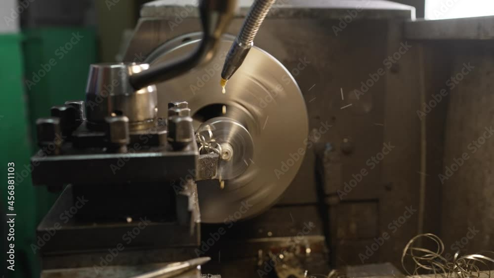 Drilling a part on a machine. Drilling and turning mold part by turning and lathe machine. Drilling a part on a machine. Drilling and turning mold part by turning and lathe machine.