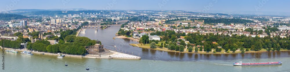 Koblenz Deutsches Eck German Corner Rhine Mosel river panorama with ships boats and cable car in Germany
