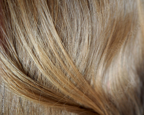 the texture of strands of straight natural light brown hair