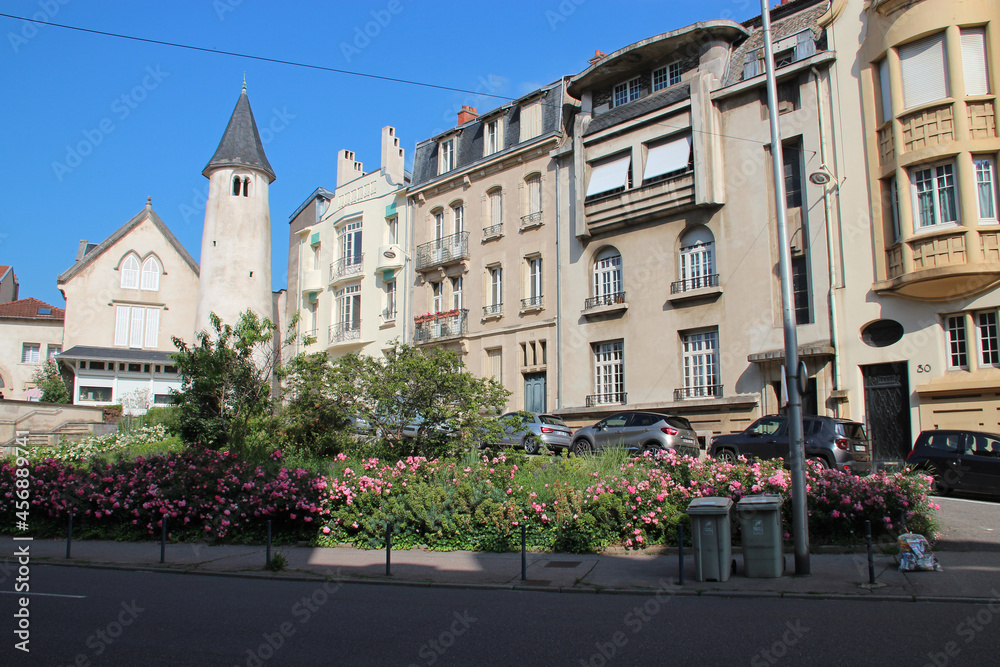 medieval tower and art déco buildings in nancy in lorraine (france)