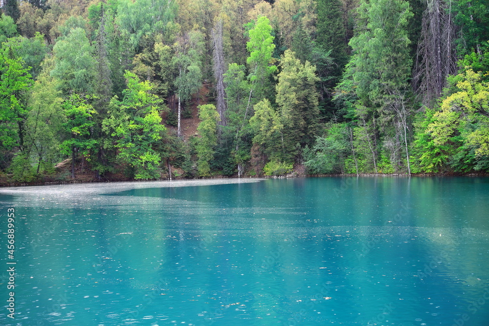 A beautiful blue big lake. Milky-blue water. Blue sky with beautiful clouds. park. a river in the forest. landscape
