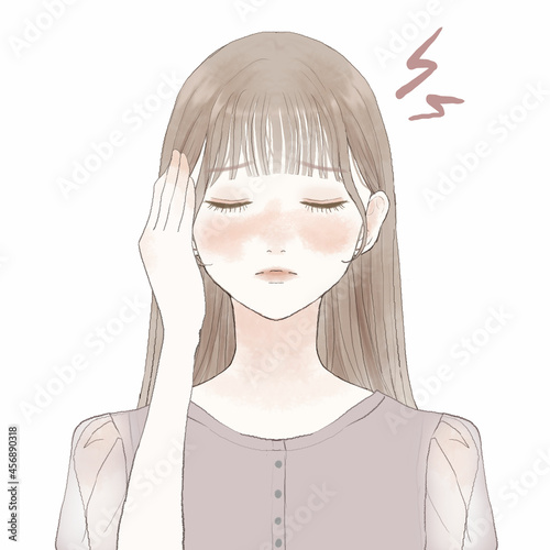 頭痛に悩まされる女性