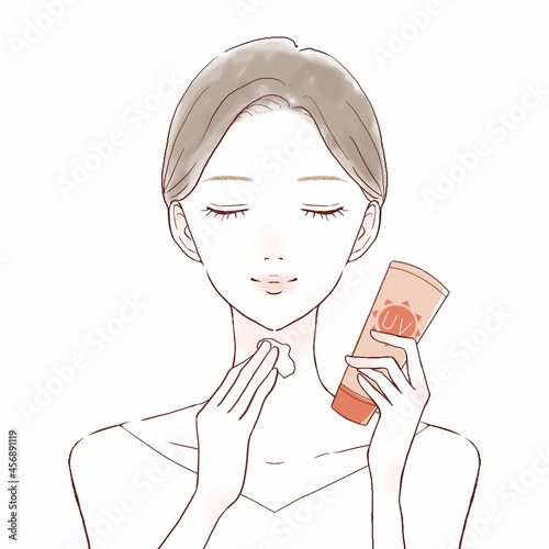 日焼け止めクリームを首に塗る女性