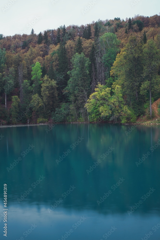 A beautiful blue big lake. Milky-blue water. Blue sky with beautiful clouds. park. a river in the forest. landscape