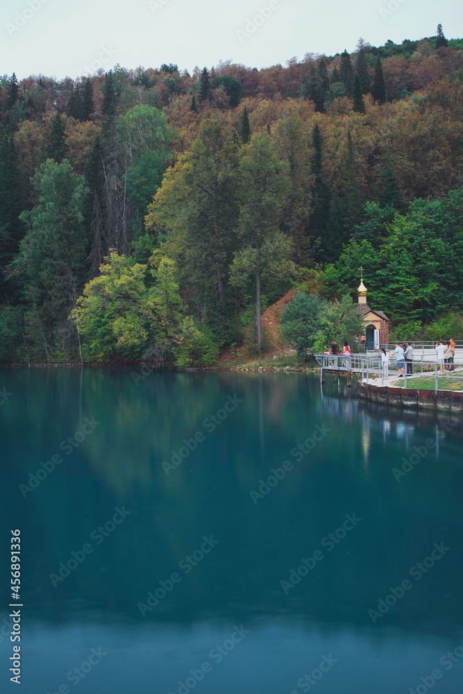 A beautiful blue big lake. Milky-blue water. Blue sky with beautiful clouds. park. a river in the forest. landscape
