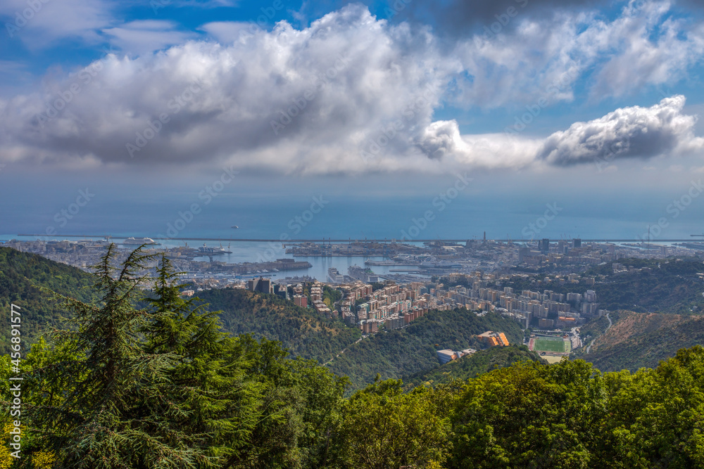 Obraz premium Aerial view of the city of Genoa under a cloudy sky, Italy.