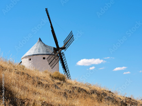 The windmills of Consuegra, located on Colle Calderico, on a sunny day in summer. photo
