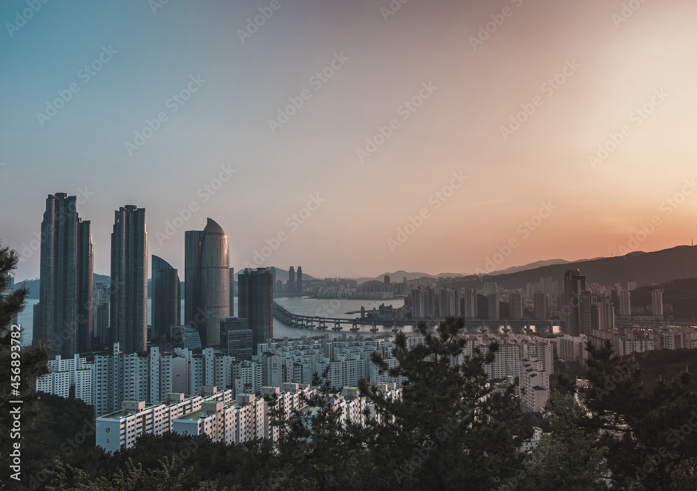 Scenic panoramic city view with skyscrapers at sunset. Picturesque view in Seoul. Lovely view of the modern city 