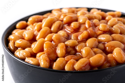 White beans in tomato sauce in bowl isolated on white background. Close up