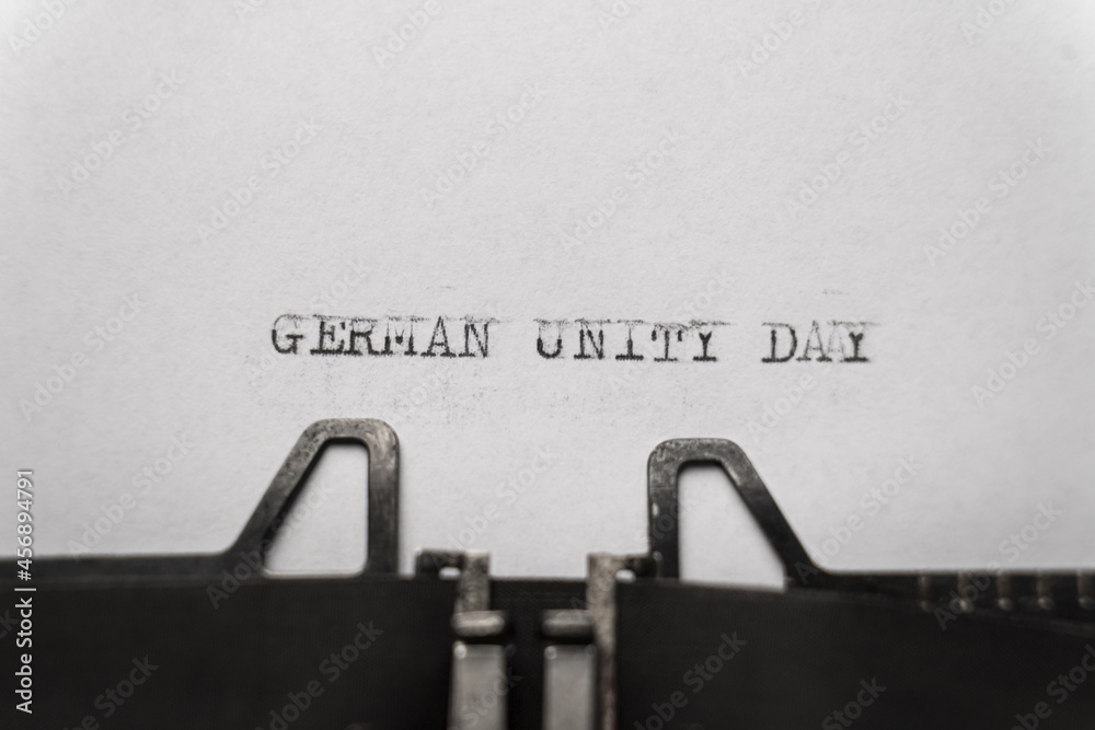 german unity day typed words on a vintage typewriter - obrazy, fototapety, plakaty 
