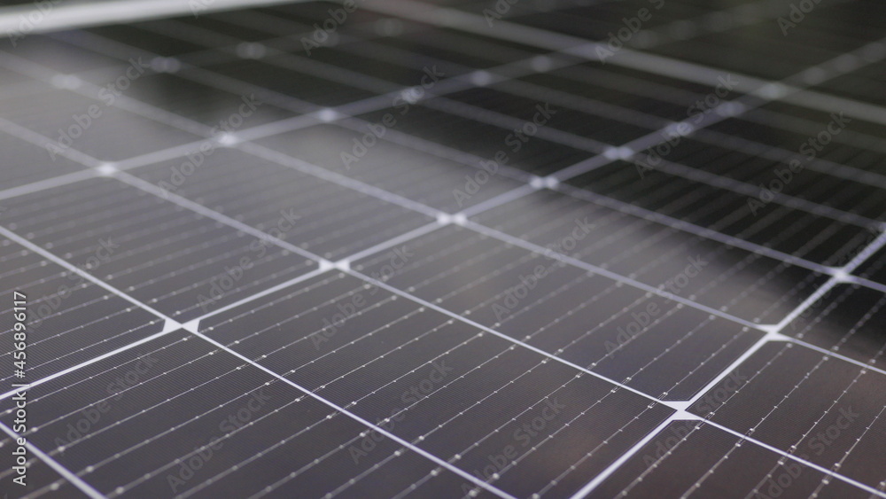 Photovoltaic solar panel extreme close up. Close-up of modern photovoltaic solar battery panels. Rows of sustainable energy solar panels installed on terrace. Solar panels on roof top. Panels at home. Photovoltaic solar panel extreme close up. Close-up of modern photovoltaic solar battery panels. Rows of sustainable energy solar panels installed on terrace. Solar panels on roof top. Panels at home.