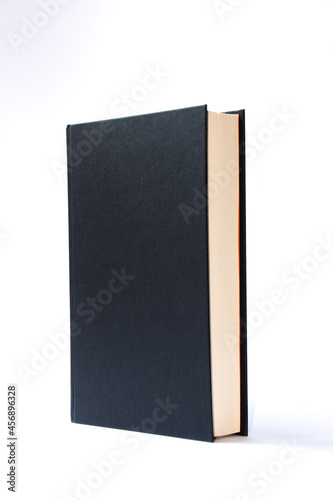 A black, blank hardcover book on white background with copy space.
