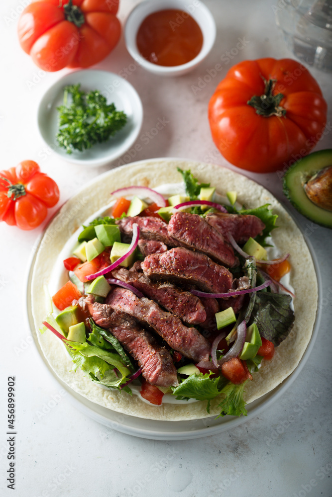 Beef steak fajitas with avocado and onion Beef steak fajitas with avocado and onion