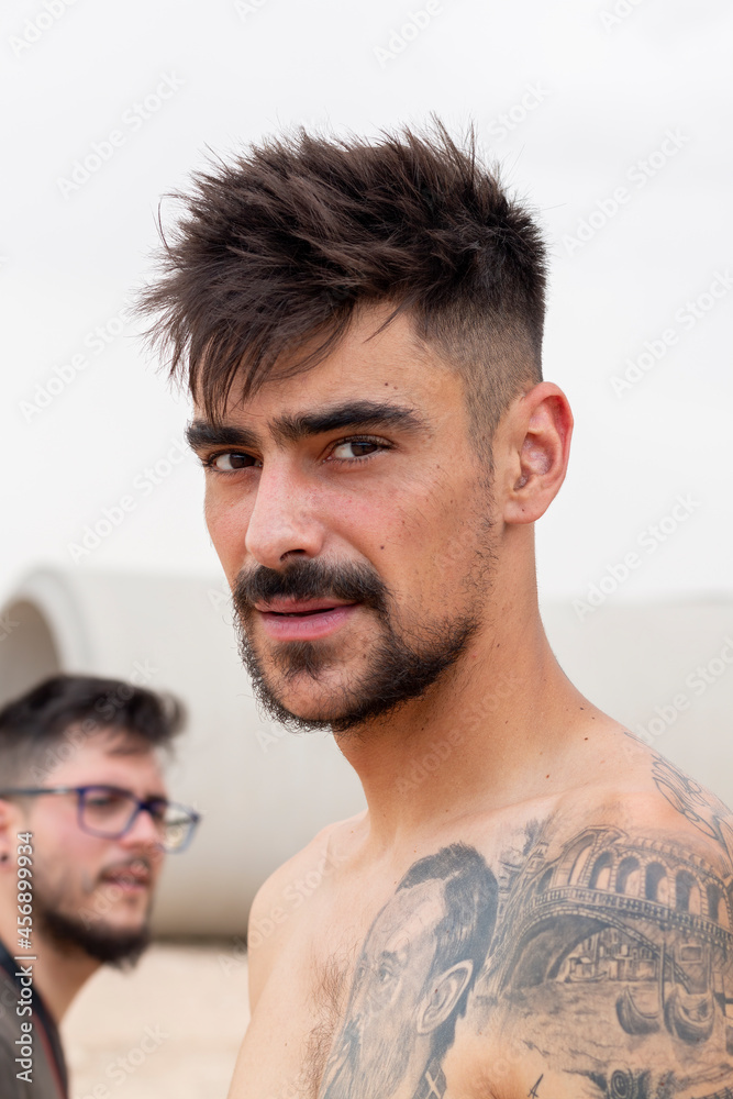Fototapeta premium Hipster culture. Young man with his tattooed body