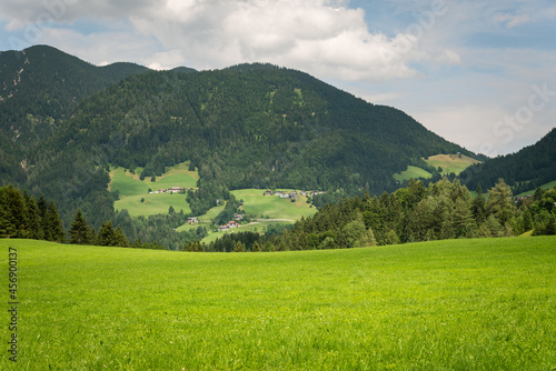 Alpine green landscape in summer on a cloudy day, Brandenberg, Tyrol, Austria photo