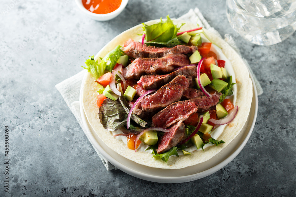 Beef steak fajitas with avocado and onion Beef steak fajitas with avocado and onion
