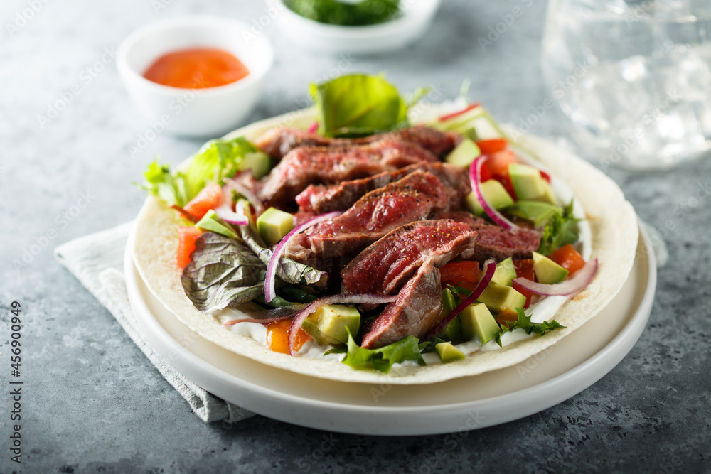 Beef steak fajitas with avocado and onion Beef steak fajitas with avocado and onion