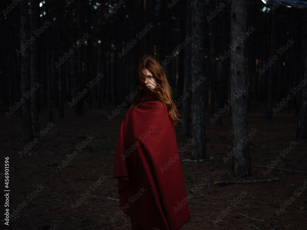 Naklejka premium woman in red plaid in the forest nature travel fresh air