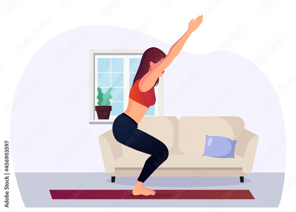 Young Woman practicing yoga Chair Pose at home Young Woman practicing yoga Chair Pose at home
