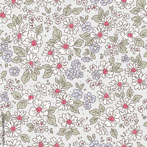 Retro floral pattern in small realistic flowers. Small white flowers. Light gray background. Liberty style print. Floral seamless background. The elegant the template for fashion prints.