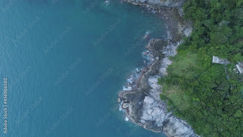 Aerial view Drone camera top down of seashore rocks in a blue ocean Turquoise sea surface. Sea waves on beautiful seascape aerial view drone 4k High quality of ocean with stone rock cliff Aerial view Drone camera top down of seashore rocks in a blue ocean Turquoise sea surface. Sea waves on beautiful seascape aerial view drone 4k High quality of ocean with stone rock cliff