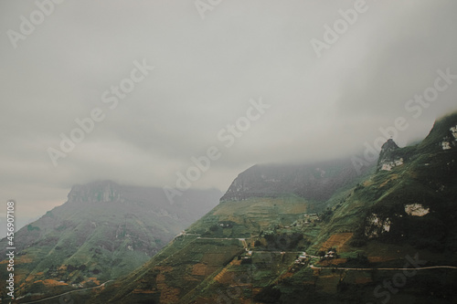 Beautiful view of the green mountains covered by mist. Dong Van Karst Plateau Geopark, Vietnam.