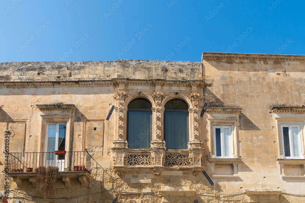 Lecce, Puglia, Italy - August 18, 2021: view of the facade of the Paladini Palace on Principi di Savoia street in the old town- detail
