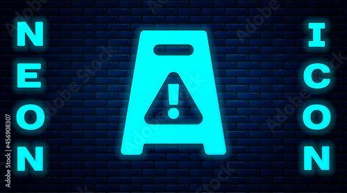 Glowing neon Wet floor and cleaning in progress icon isolated on brick wall background. Cleaning service concept. Vector