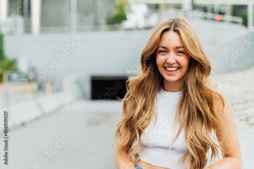 Portrait of young caucasian woman posing outdoor smiling having fun - advertising copy space