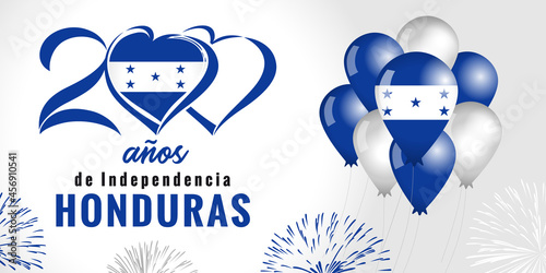 200 anos anniversary Indepedencia Honduras, spanish text - 200 years anniversary Independence Day from Spain. Celebration background with fireworks, flag in balloons and lettering. Vector illustration photo