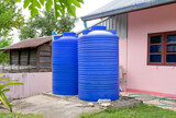Blue plastic water tanks.
