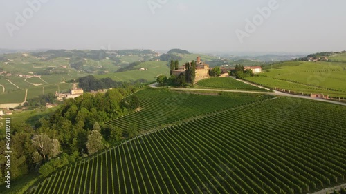 La Volta and Falletti castles aerial view situated in Barolo, Langhe region, Piedmont (Piemonte), Northern Italy. Famous Italian castle tourism travel destination in Europe. Surrounded by vineyards. photo