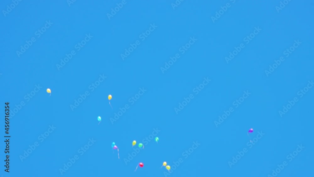 Colourful balloons flying in the blue sky Colourful balloons flying in the blue sky