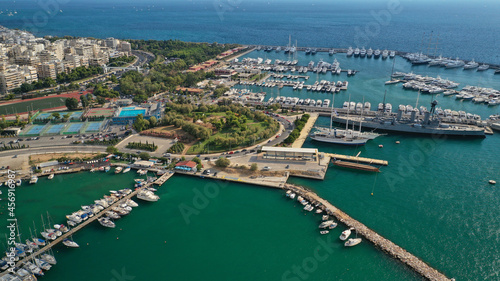 Aerial drone bird's eye view of small port and Park of Maritime Tradition where historic Averof warship is docked, Floisvos, Faliro Marina, Attica, Greece © aerial-drone
