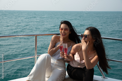 Two asian young businesswomen at the yacht in summer